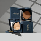 Lavertu Terre de Soleil baked bronzers in multiple shades displayed in blue compacts with integrated mirrors and brushes.