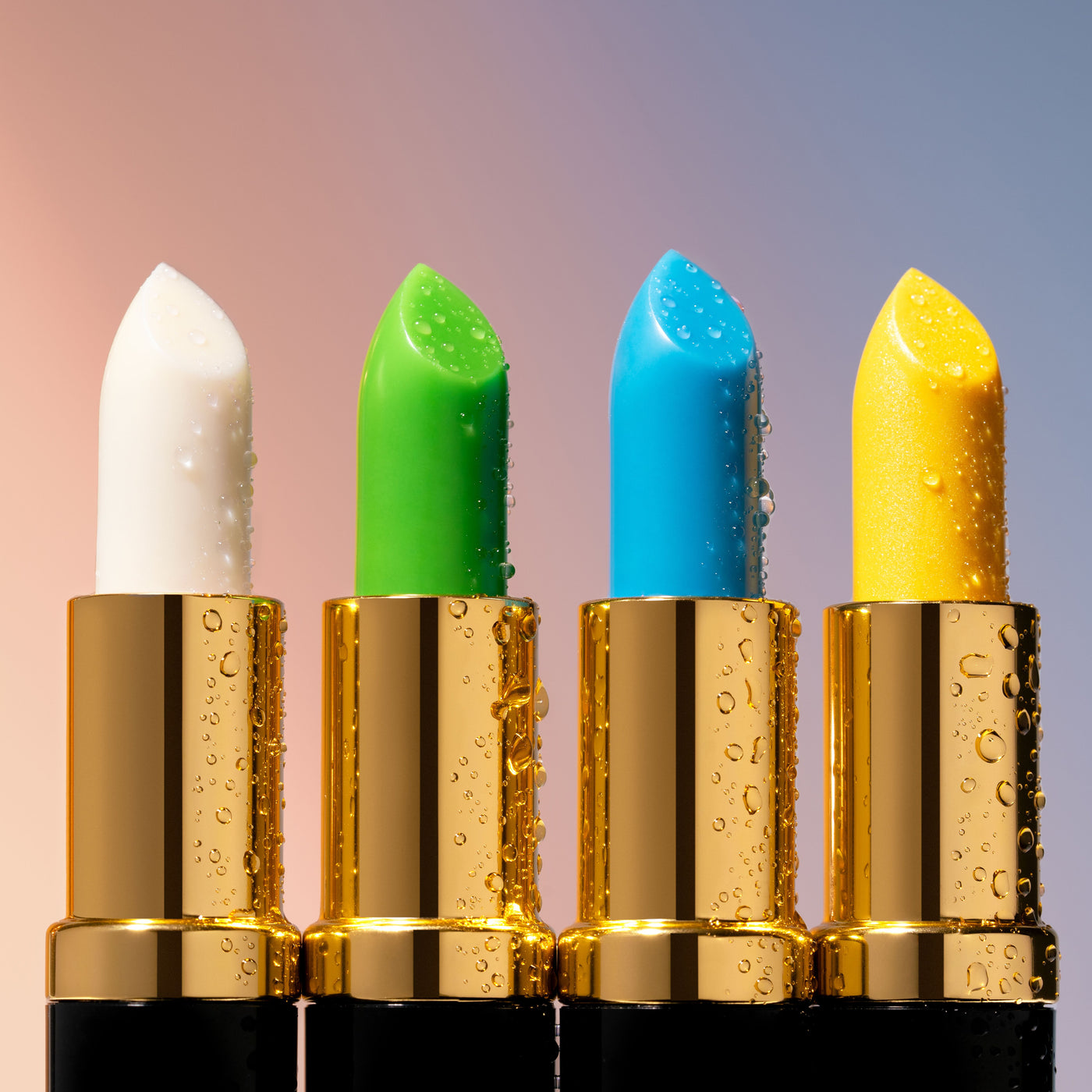 Four Lipstick Excellent colour-changing lipsticks in white, green, blue and yellow with luxurious gold packaging.