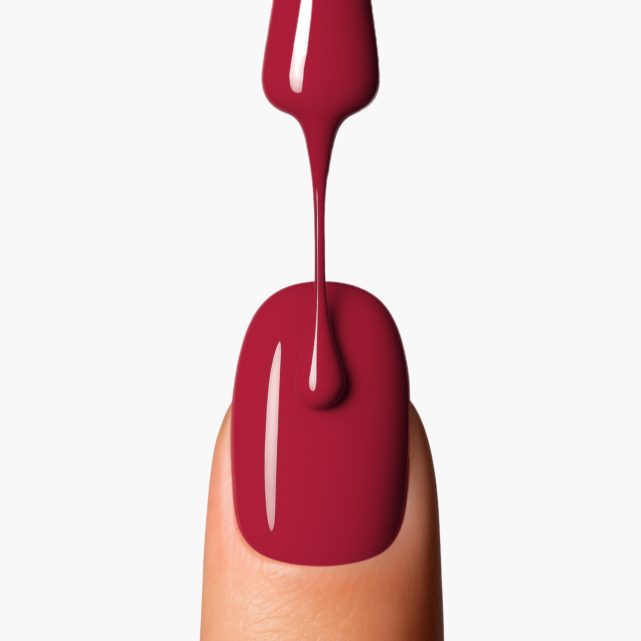 Application close-up of LAVERTU Nail Polish Nature 37 Messira Red showing a warm brick red shade with earthy undertones, smooth even coverage and high-gloss finish on the nail.