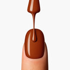 LAVERTU Nail Polish Unique 24 Deneb Brown application showing a warm bronze brown nail colour with subtle metallic shimmer smooth application and glossy finish on the nail.