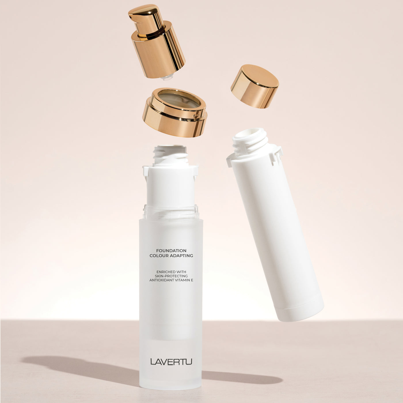 Lavertu colour adapting foundation refill with foundation brush in warm, natural light